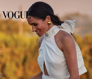 VOGUE: Meghan Brings Pleats, PDA & Vintage Chanel To The Polo